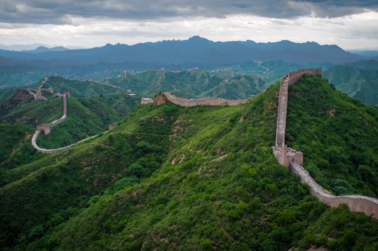 The Great Wall winding over green mountains at Jinshanling