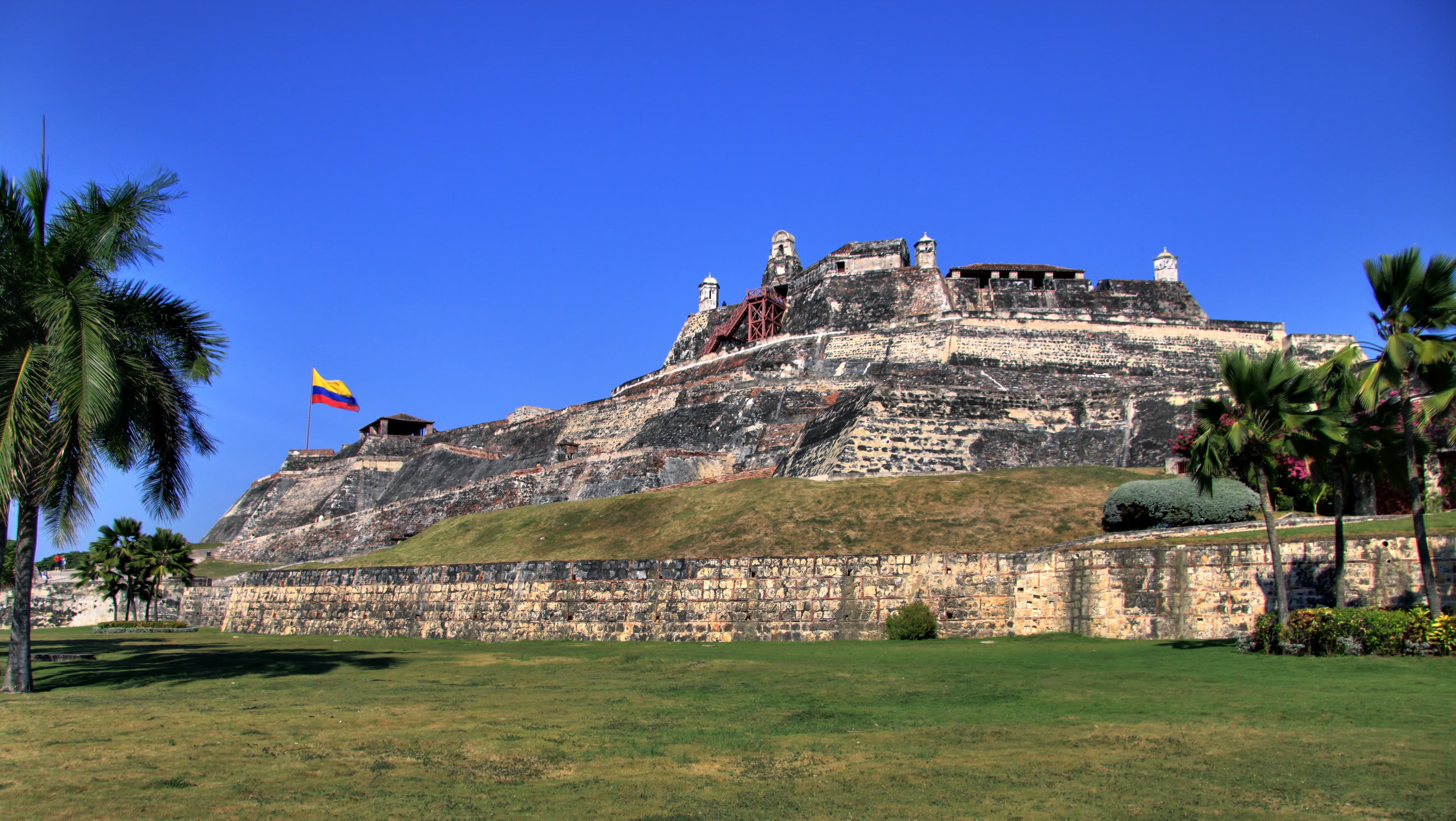 The colourful colonial buildings of Cartagena's old city with the city walls behind