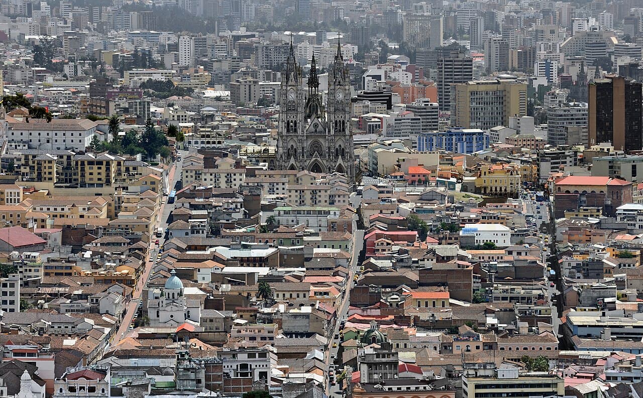 The colourful colonial buildings and churches of Quito's historic old town with the Andes behind