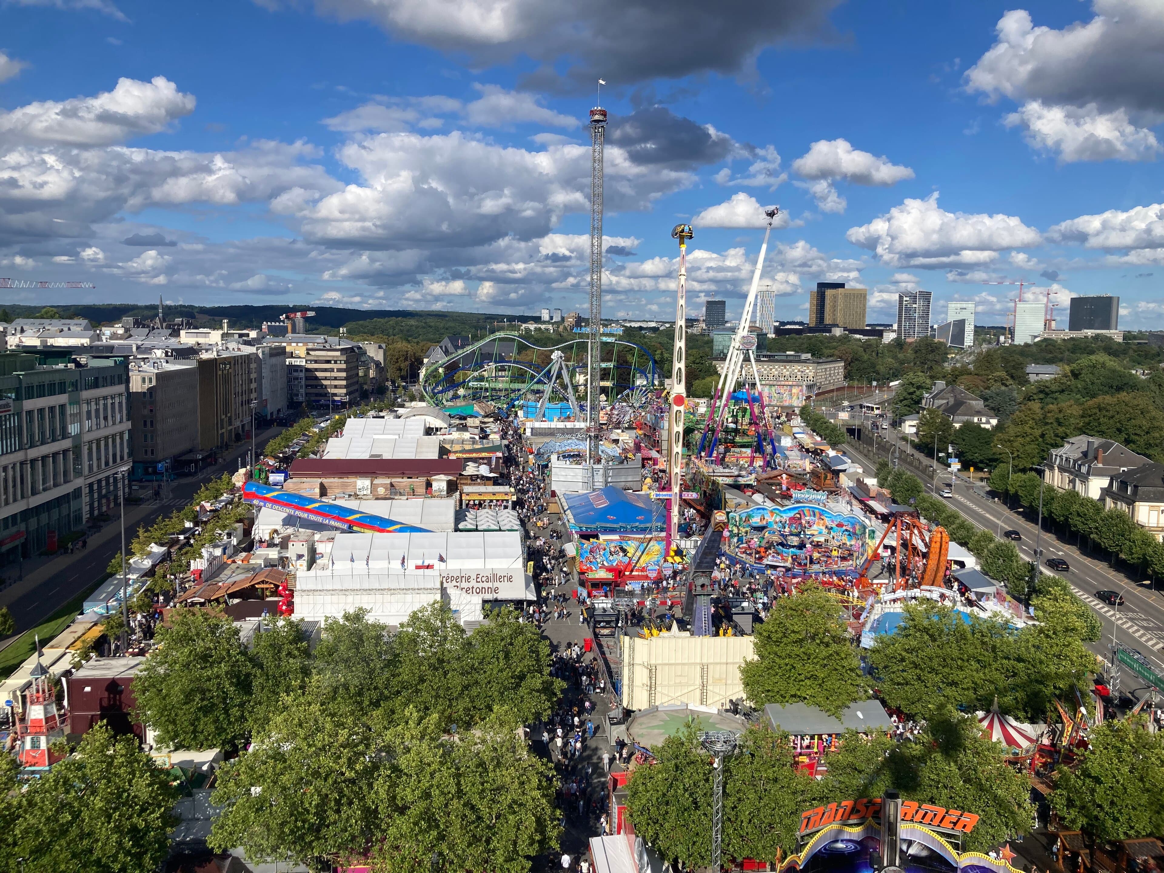 The Schueberfouer funfair at night with illuminated rides and stalls