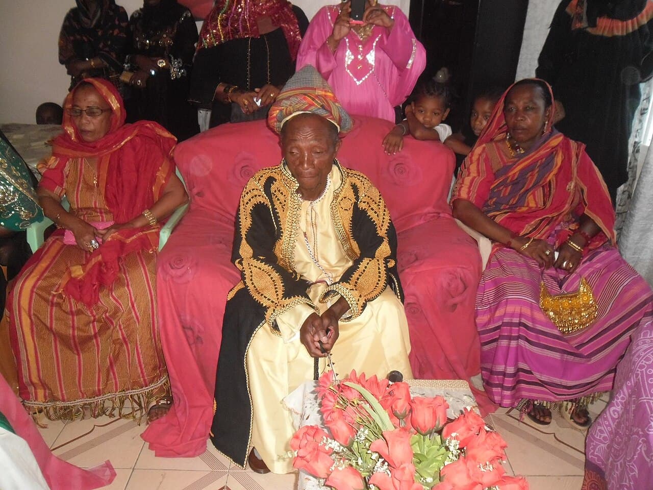 Colourfully dressed guests dancing and celebrating at a Grand Mariage community festival in Comoros