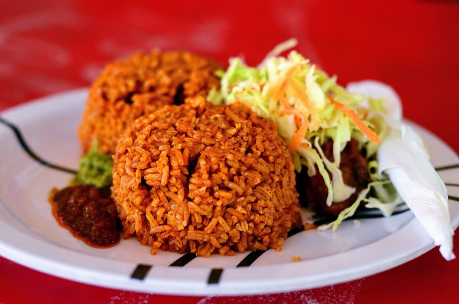 A plate of bright orange jollof rice