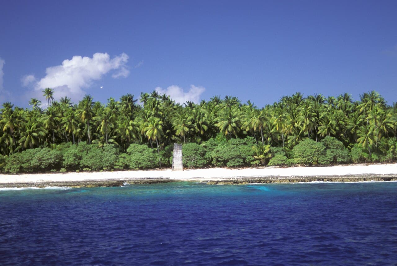 The rocky limestone cliffs of Banaba rising above the Pacific Ocean