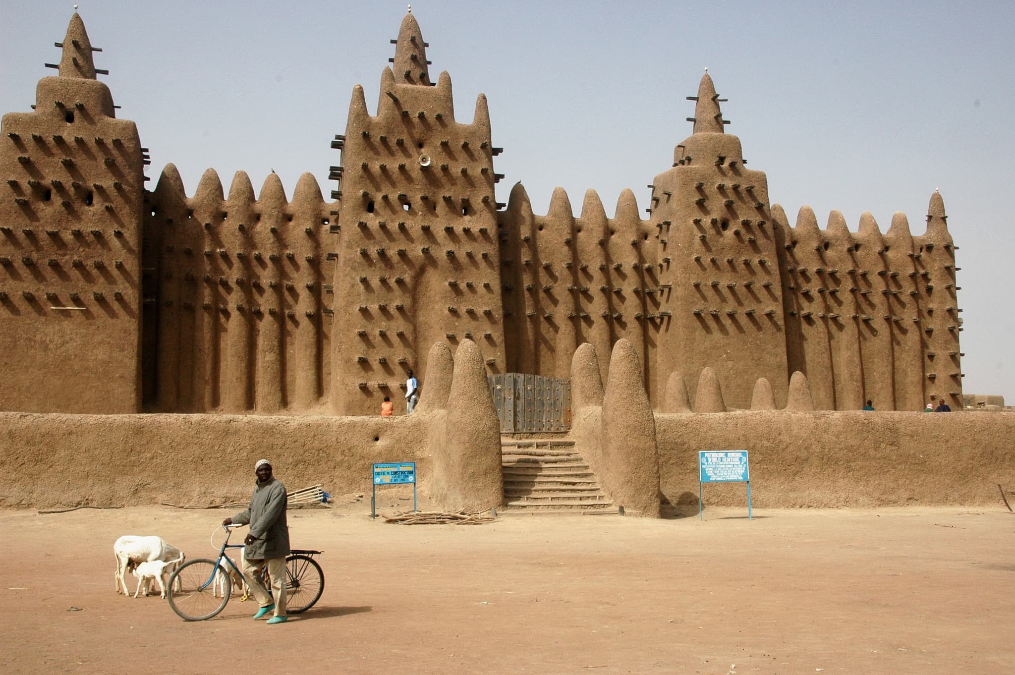The Great Mosque of Djenné with its tall towers rising above the busy market square