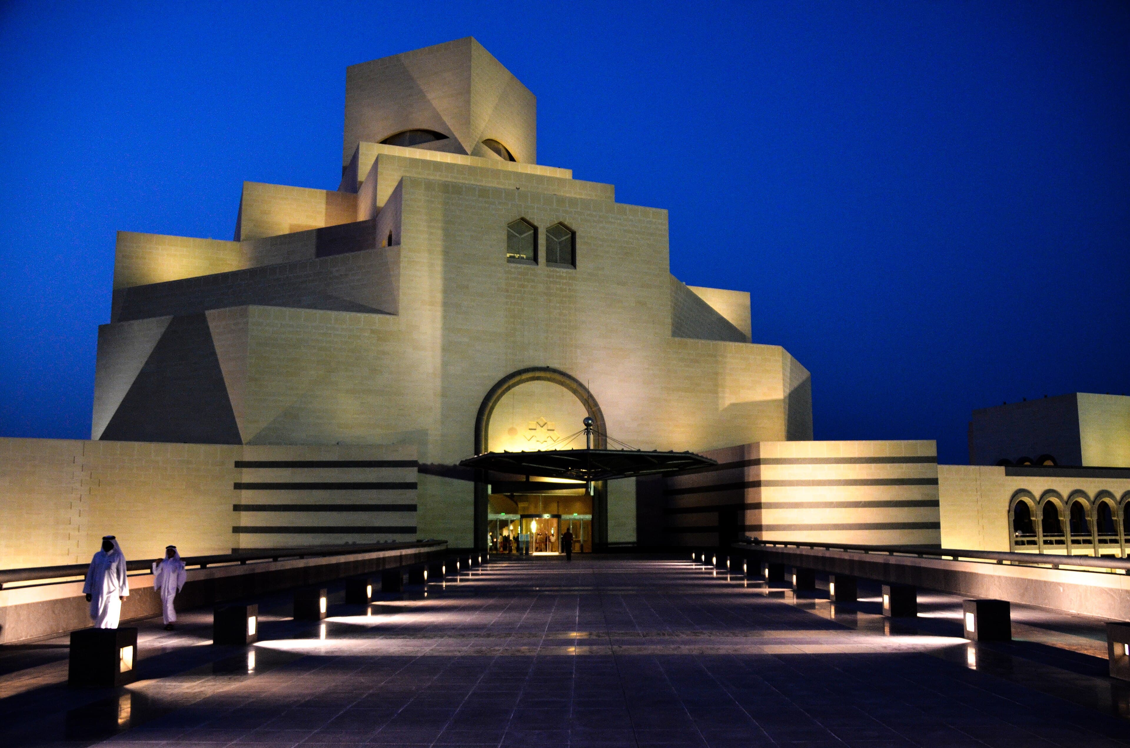 The white geometric Museum of Islamic Art rising from its own island in Doha harbour